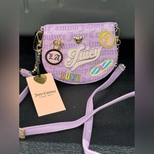 Juicy Couture “Run The World” Mini Rounded Flap Crossbody Bag lavender color